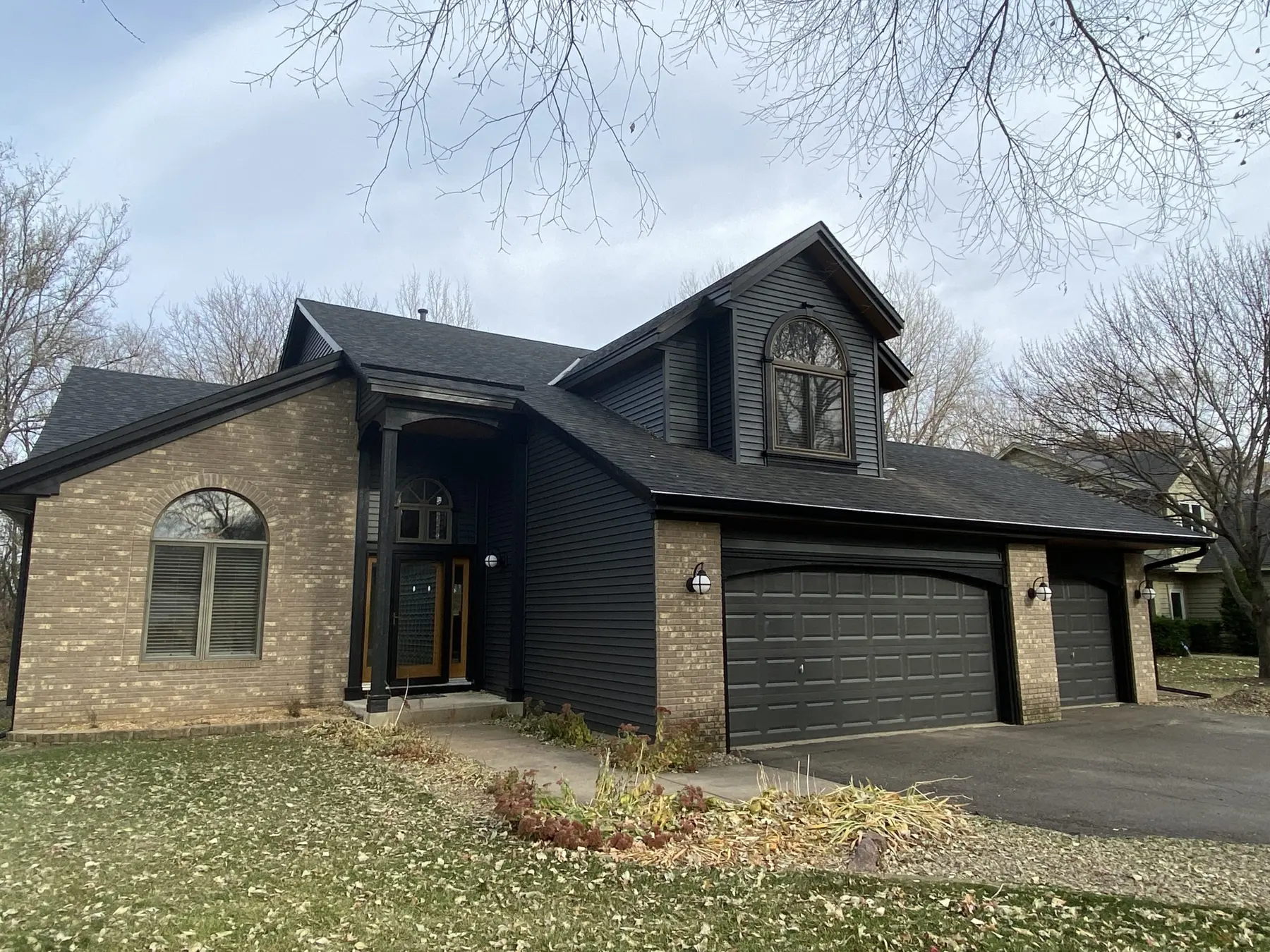 Completed home exterior with new siding